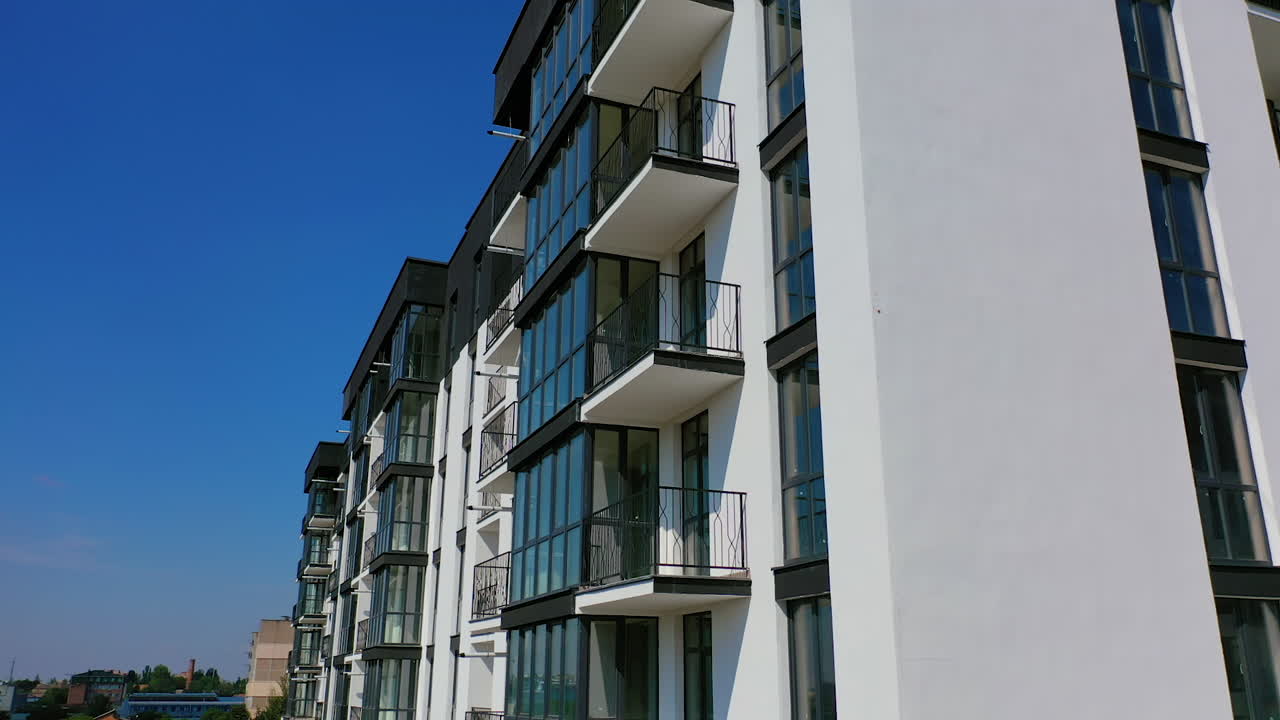 New apartment house. Detailed video on balconies of freshly built high-rise buildings. Dron video.