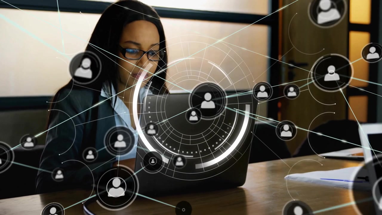 Businesswoman typing on laptop at meeting table, expanding technology network overlay mapping nodes