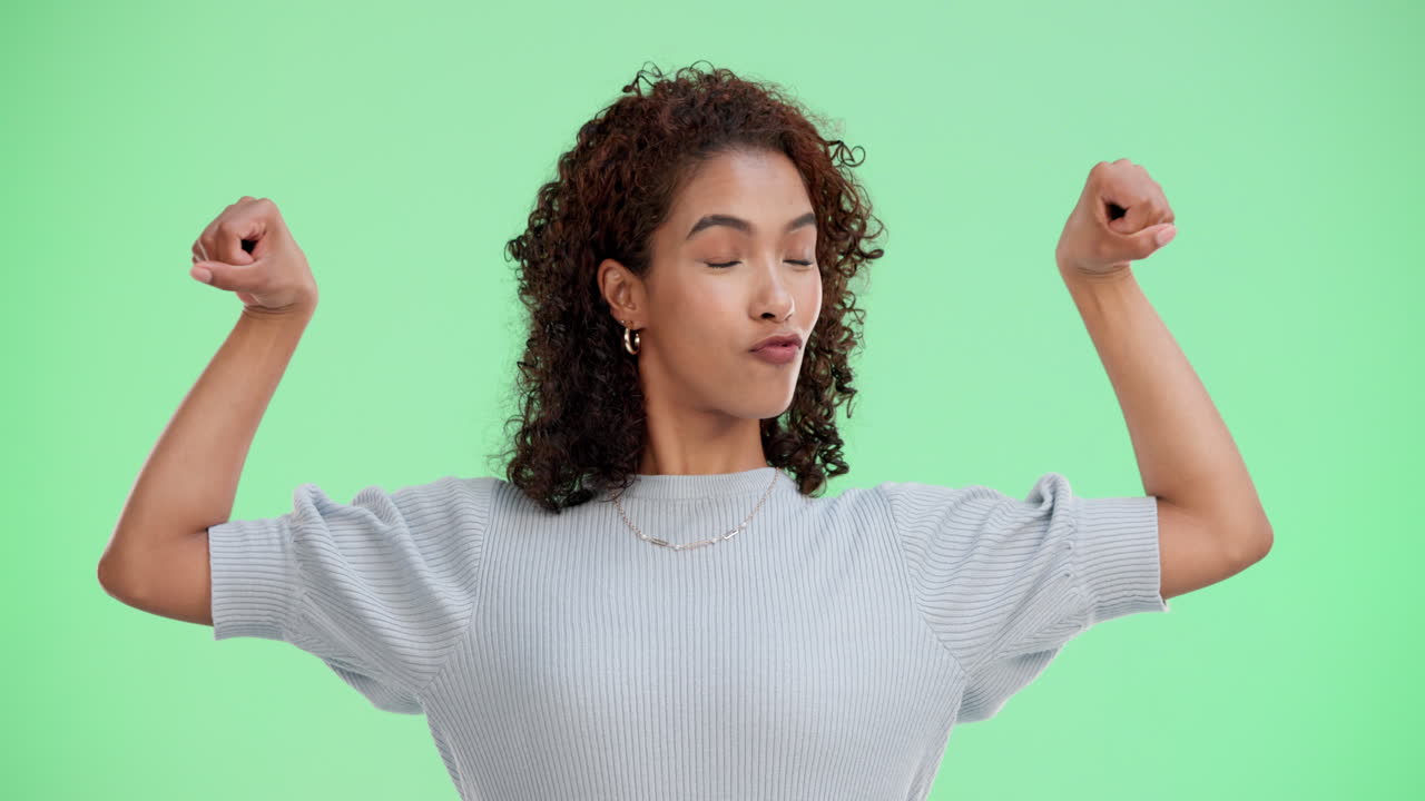 Confident woman flexing muscles
