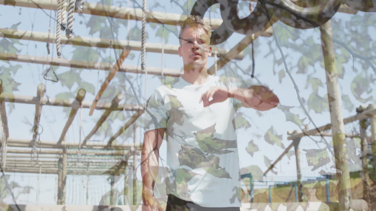 Man wiping forehead in obstacle course with leaves animation overlay