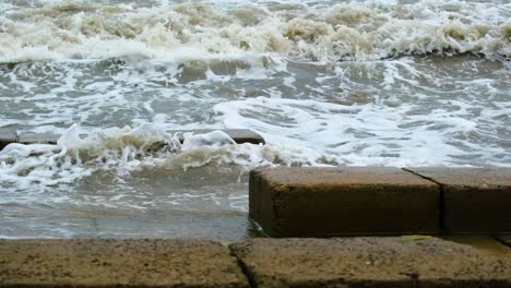 Waves in the ocean breaking against cliffs