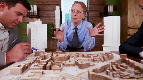 Senior-female-architect-in-a-meeting-with-construction-engineers