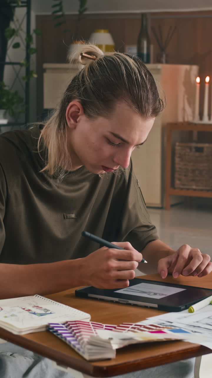 Fashion Creator Drawing on Tablet PC at Studio