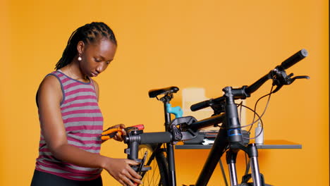 Mechanic-preparing-work-tools-before-starting-repairing-broken-bicycle