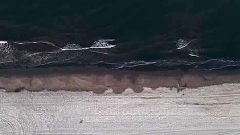 cinemagraph loop of beach waves from aerial view