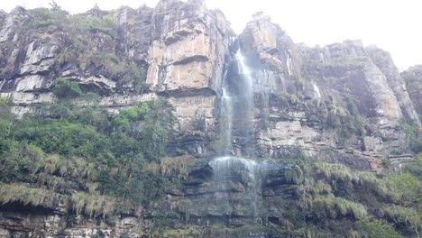 waterfall down cliff into natural pool in a forest in southern africa - sabie