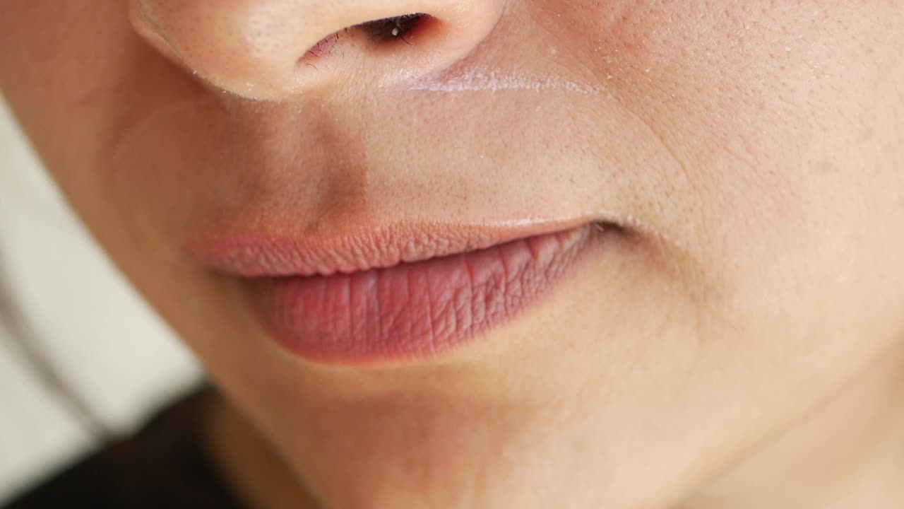 Woman getting her upper lip waxed