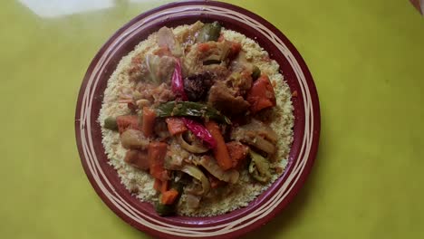 couscous meal with meat and vegetables in a traditional arabic plate ,morocco -1