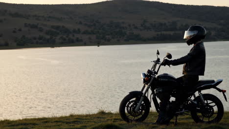 motorcycle rider by the lake