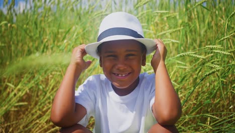 smiling boy in a wheat field