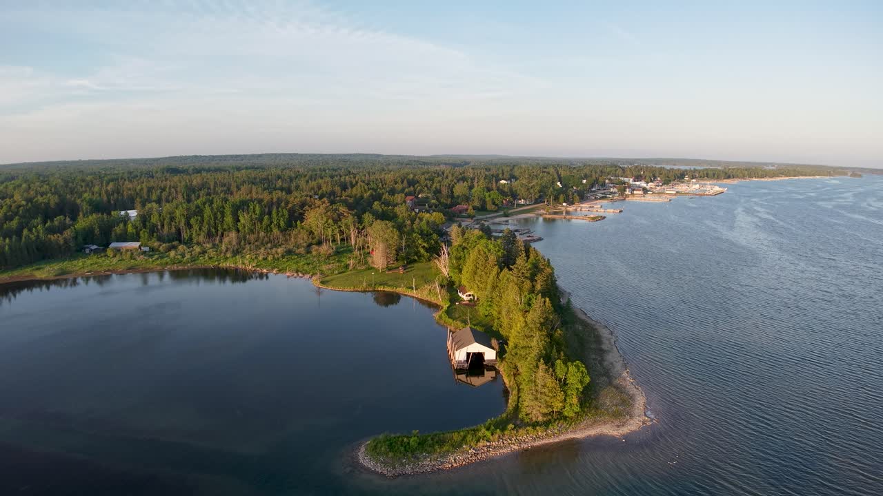 Aerial golden hour view of small bay and Hessel Michigan, Les Cheneaux