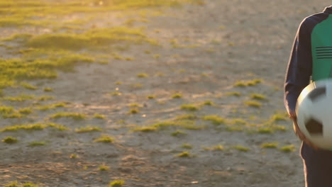 boy alone playing with the football in the ground 4k