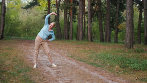 woman stretching in a forest