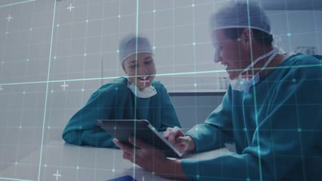 animation of data processing over caucasian male and female surgeons using tablet
