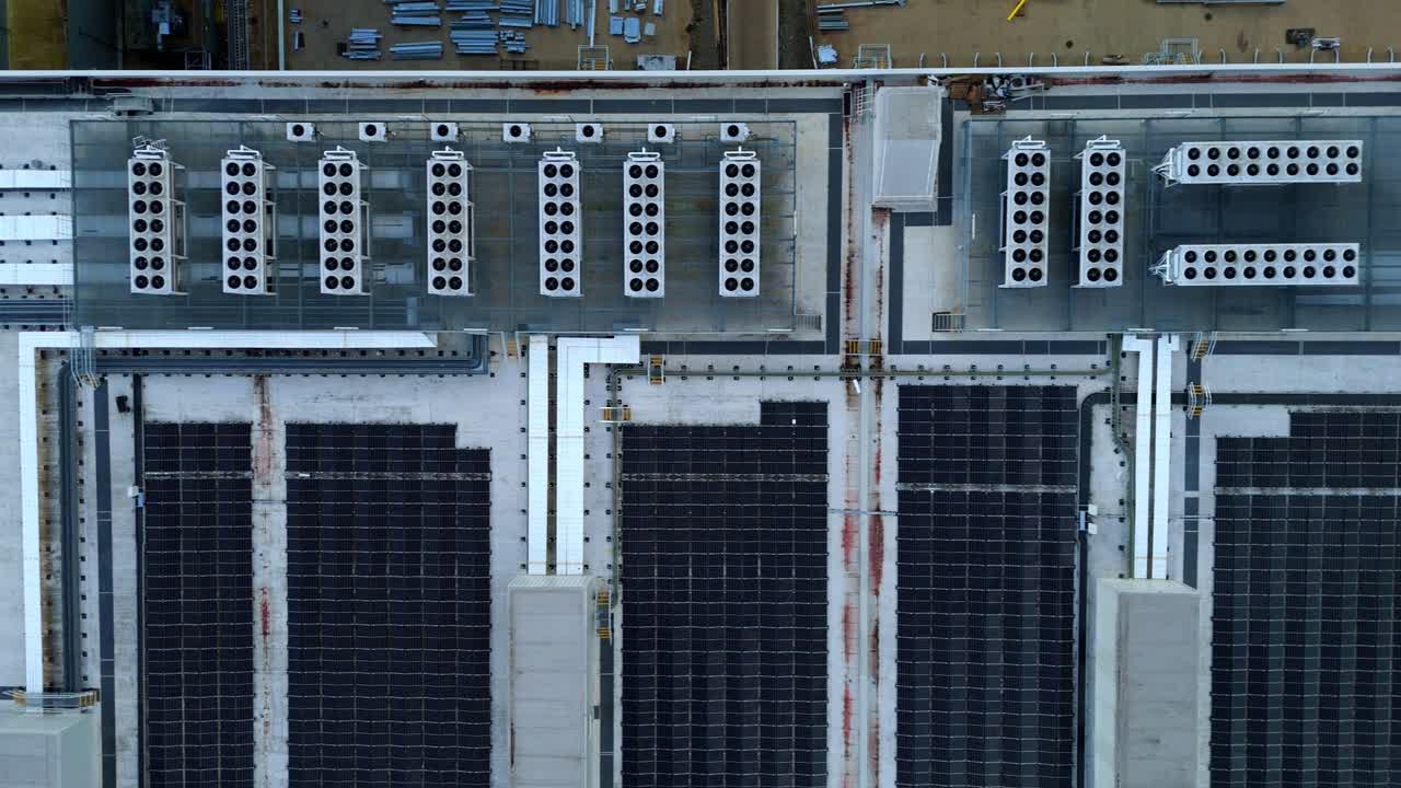 Top down aerial drone view of industrial cooling fans turbines air conditioning spinning in United Kingdom