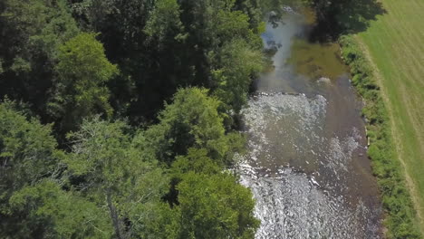 High-aerial-shot-of-the-New-River-as-it-flows-through-Ashe-County,-North-Carolina