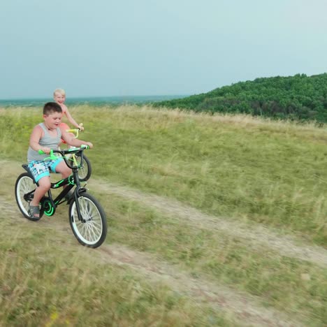 two children race down the hill