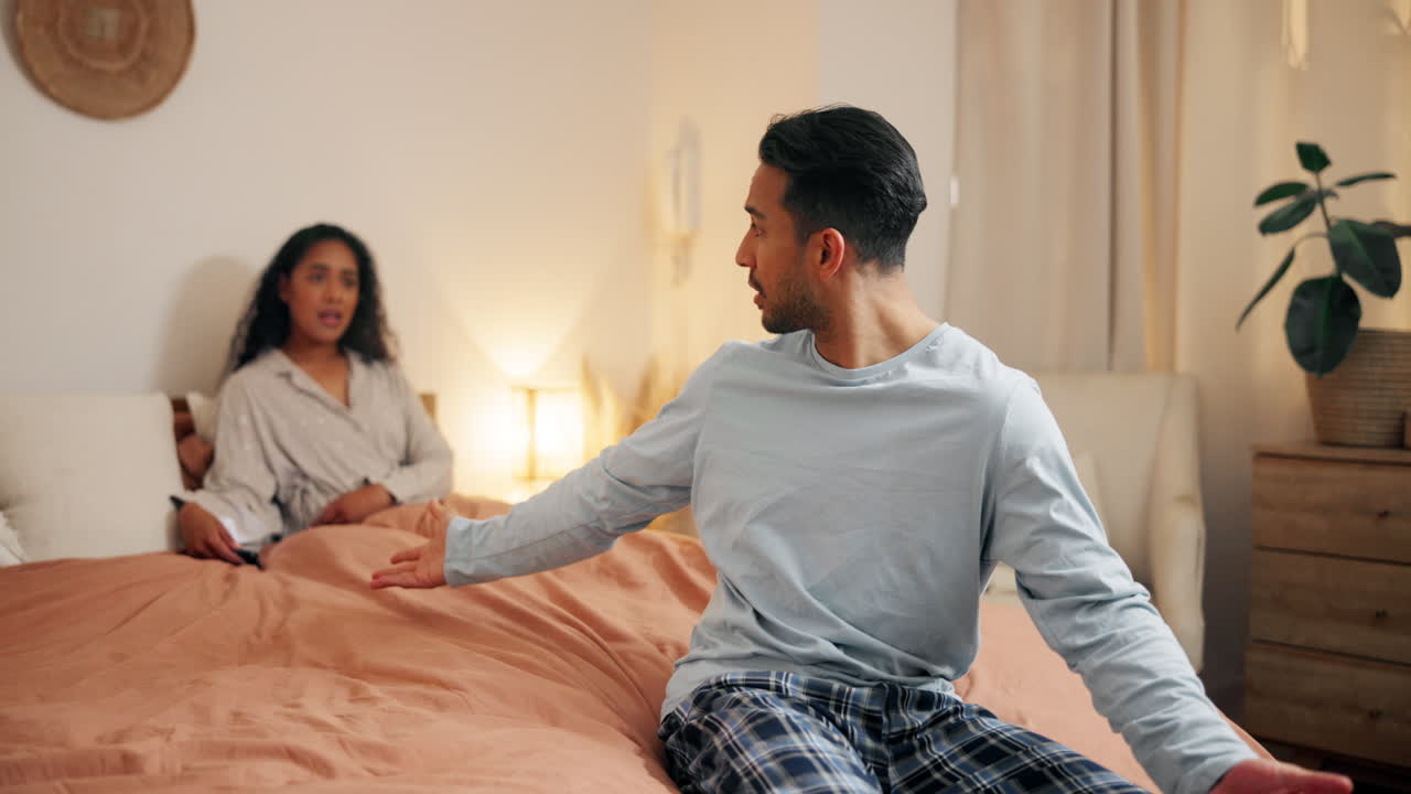 Couple Arguing in Bed