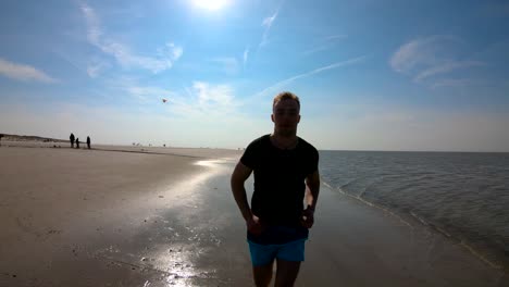 Man-running-at-the-ocean.-Slow-motion