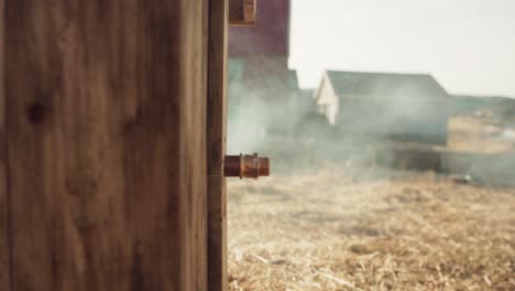 A-Man's-Hand-Lifts-the-Lid-Off-the-Pipe-of-the-DIY-Hot-Tub---Close-Up