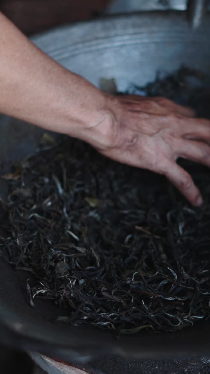 Tea processing with hand stirring