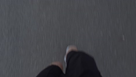 a close-up of a man running a marathon on a street with white sport shoes, viewed from an pov perspective