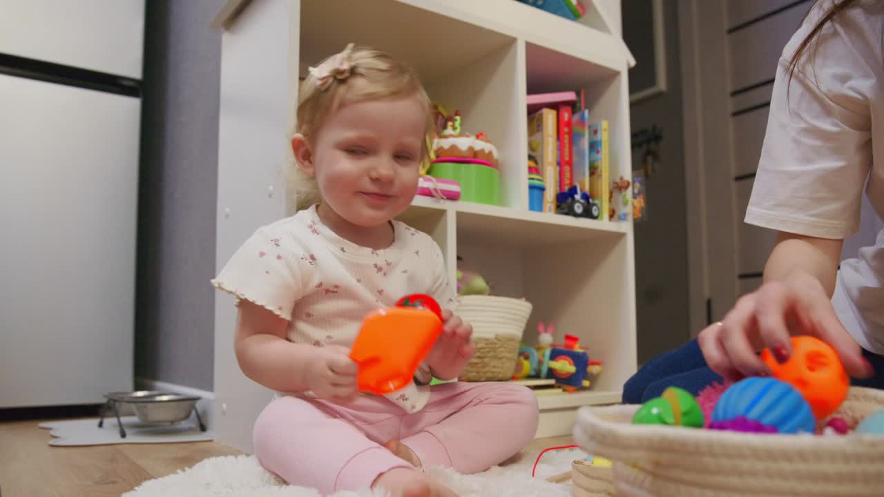 Happy Toddler Girl Playing with Toy Food and Learning to Cut