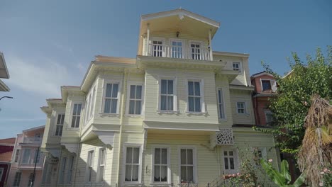yellow wooden house in a town