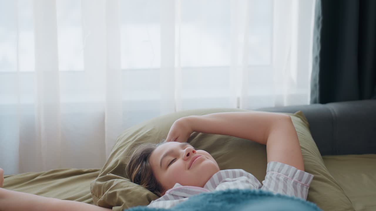 Serene Woman Relaxes On Couch In Morning Light, Gentle Morning Scene With Woman Relaxing On Sofa Peacefully, Tranquil Scene Of Woman Resting Comfortably On Couch During Morning Hours