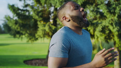 man breathing during marathon outdoors