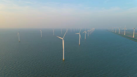 huge windmill turbines, offshore windmill farm in the ocean westermeerwind park , windmills isolated at sea on a beautiful bright day netherlands flevoland noordoostpolder