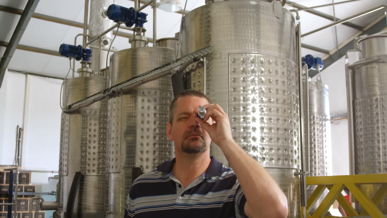 Male worker using magnifying glass 4k