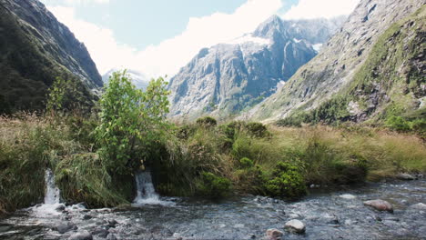 Crystal-clear-mountain-stream-flowing-through-pristine-wilderness,-nourished-by-snowmelt