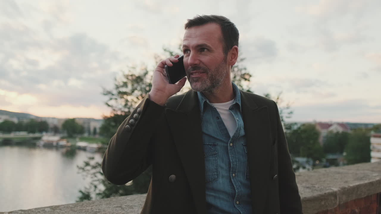 Man talking on the phone outdoors