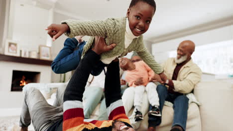 Father,-kid-and-airplane-game-on-floor-in-family