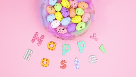 happy easter text and eggs in basket move on paste pink theme. stop motion