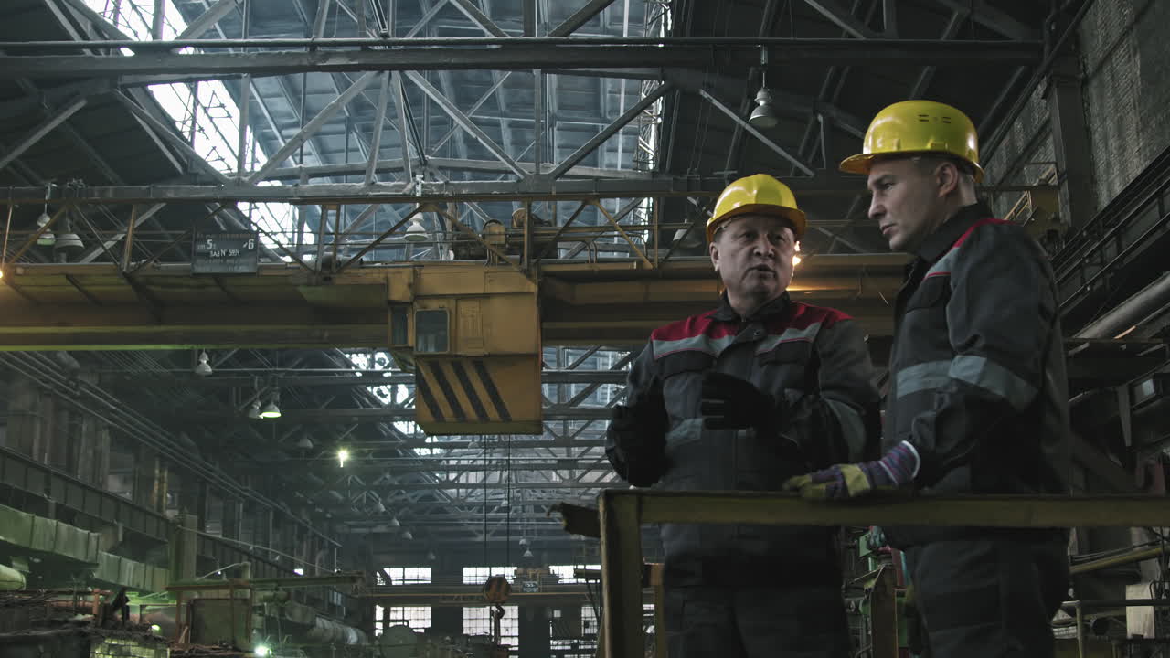 Plant Workers Talking At Workplace