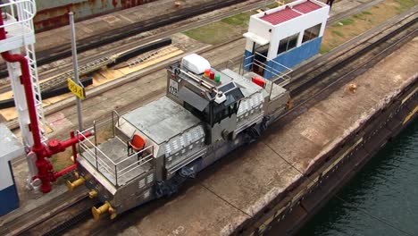 port side electric locomotive pulling the ship thru the gatun locks, panama canal