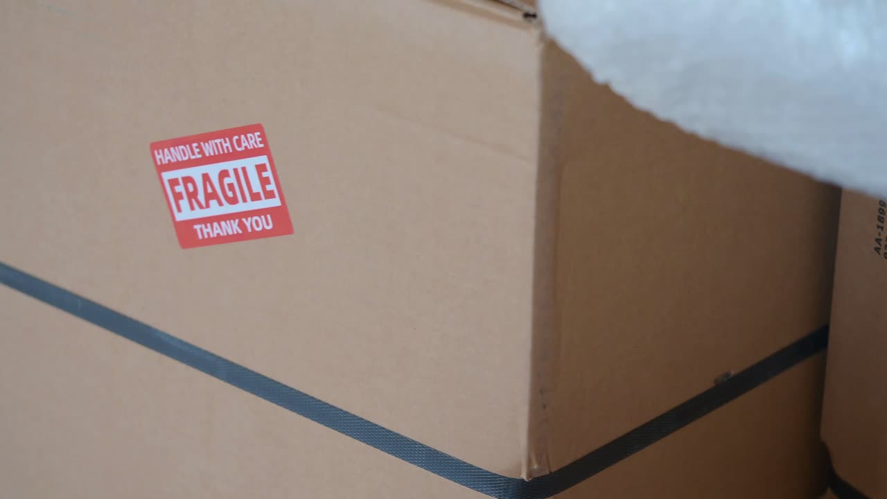 Fragile shipping box with handle with care sticker