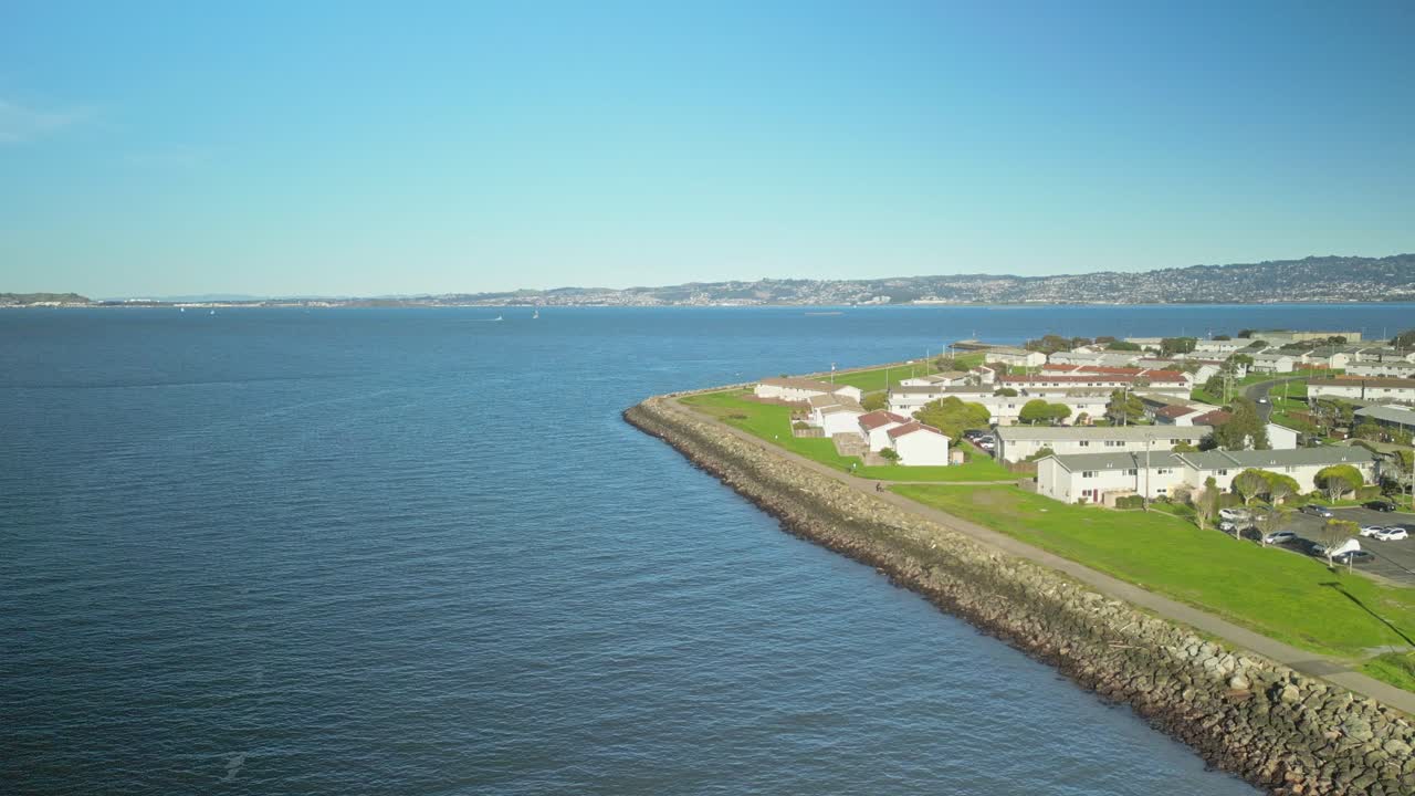 Orbit drone shot of Treasure Island in the day with Pacific Ocean in California, USA