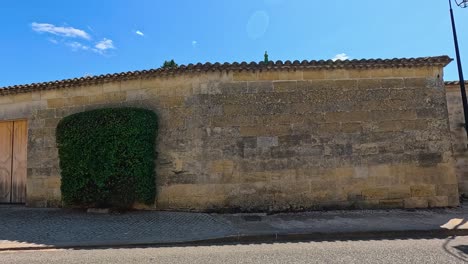 a truck navigates a narrow street in saint-émilion