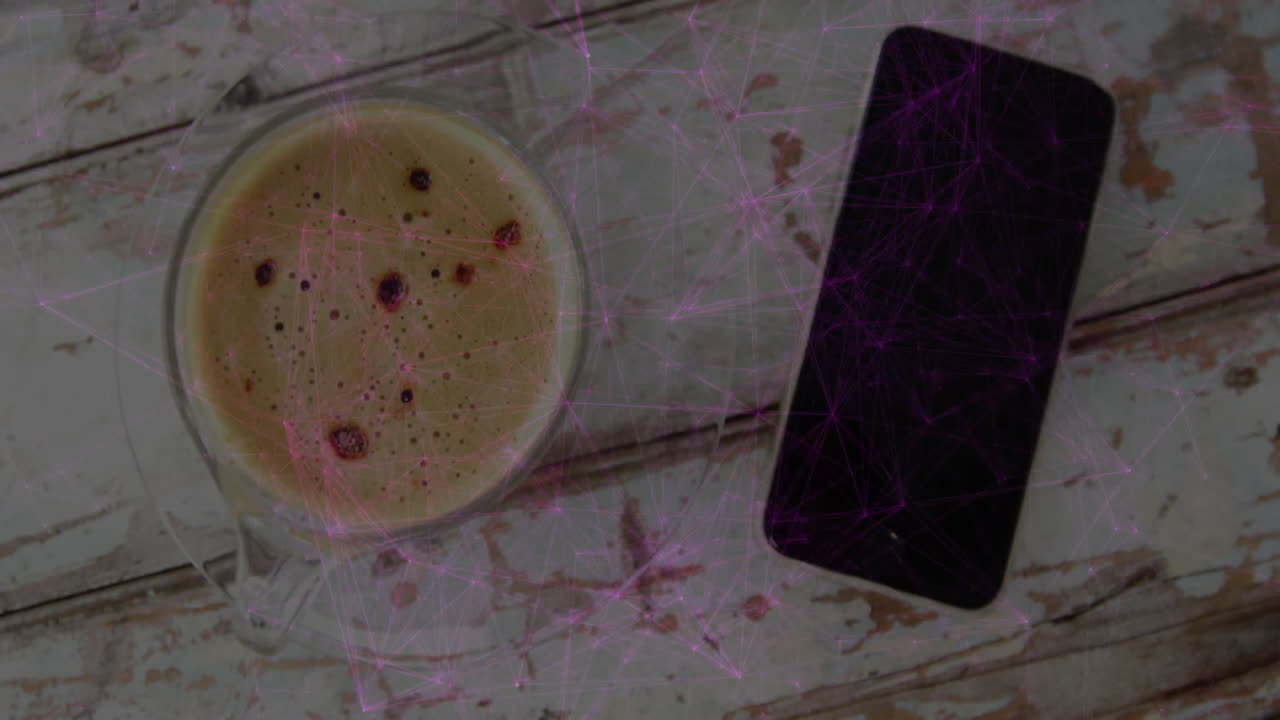 espresso cup being placed on weathered wooden table, showing black smartphone beside glass saucer
