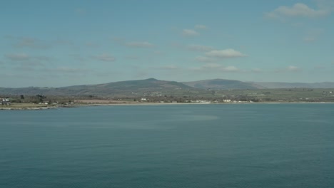 Beautiful blue ocean near sea coast aerial shot at day, wide angle