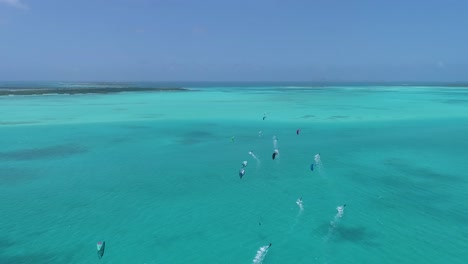 Aerial-Shot-Group-People-Kitesurf-On-Caribbean-Sea-Sailing-Kitesafari-Los-Roques