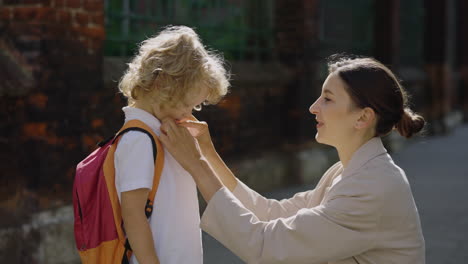 mother and child getting ready for school