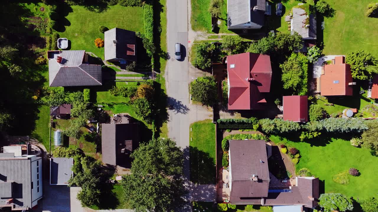 Summer rooftops and gardens in green Pļavnieki residential suburb, Latvia, drone
