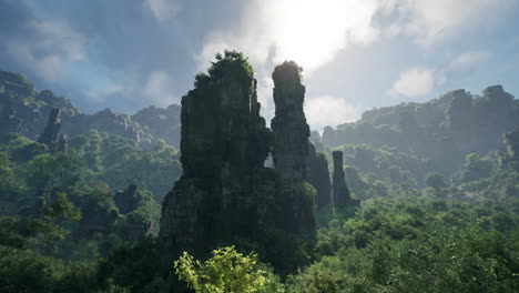 tall cliffs rise from a lush green forest, bathed in sunlight.