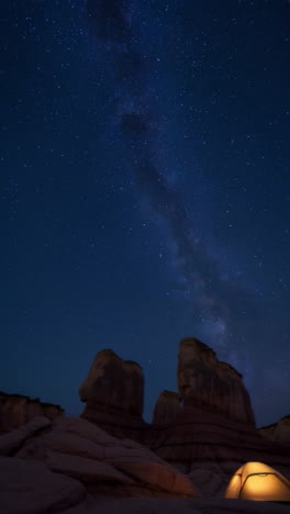 camping under the milky way in a red rock canyon
