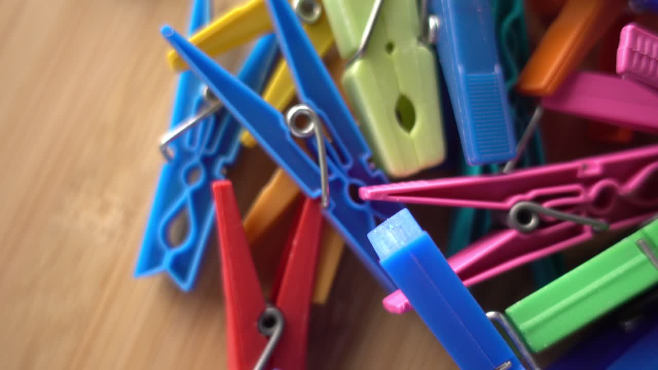 Multi coloured plastic clothes pegs
