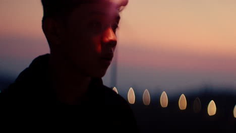 man with headlamp at sunset